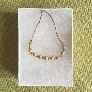 Gold colored necklace